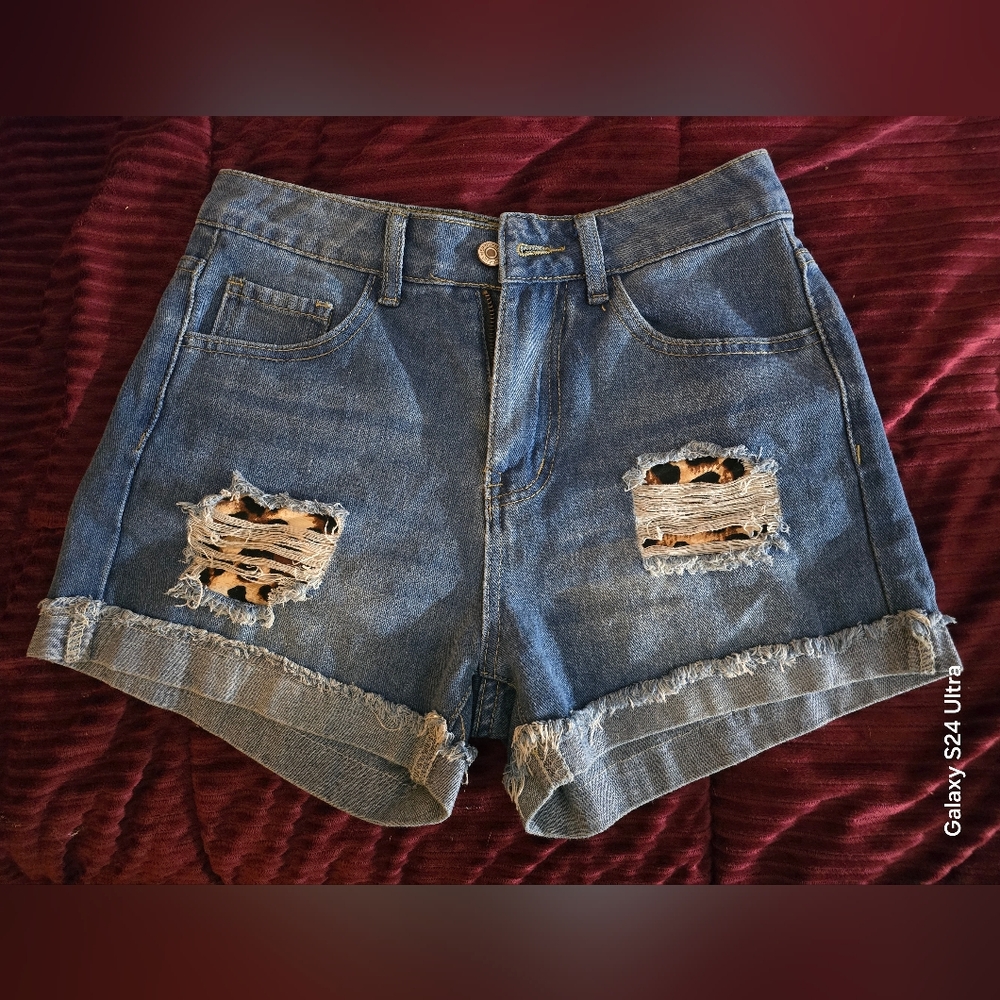 Distressed with Leapord denim blue jean shorts size small womans